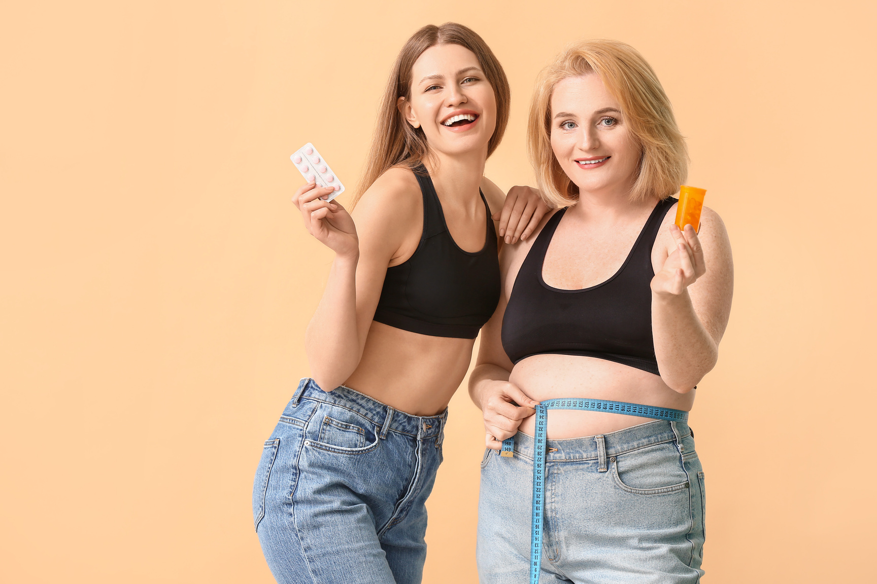 Women with Weight Loss Pills on Beige Background
