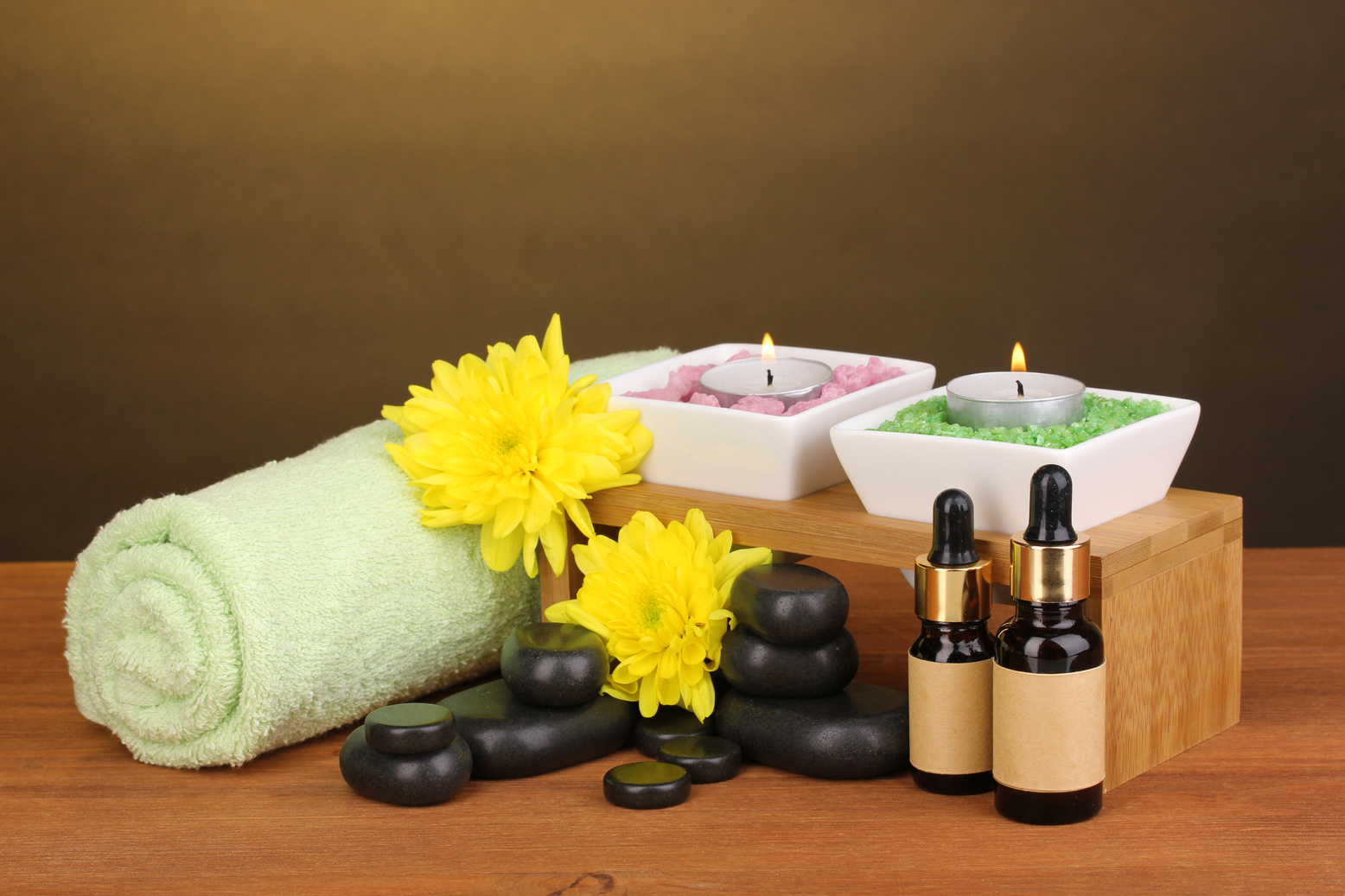 Spa Setting on Wooden Table on Brown Background