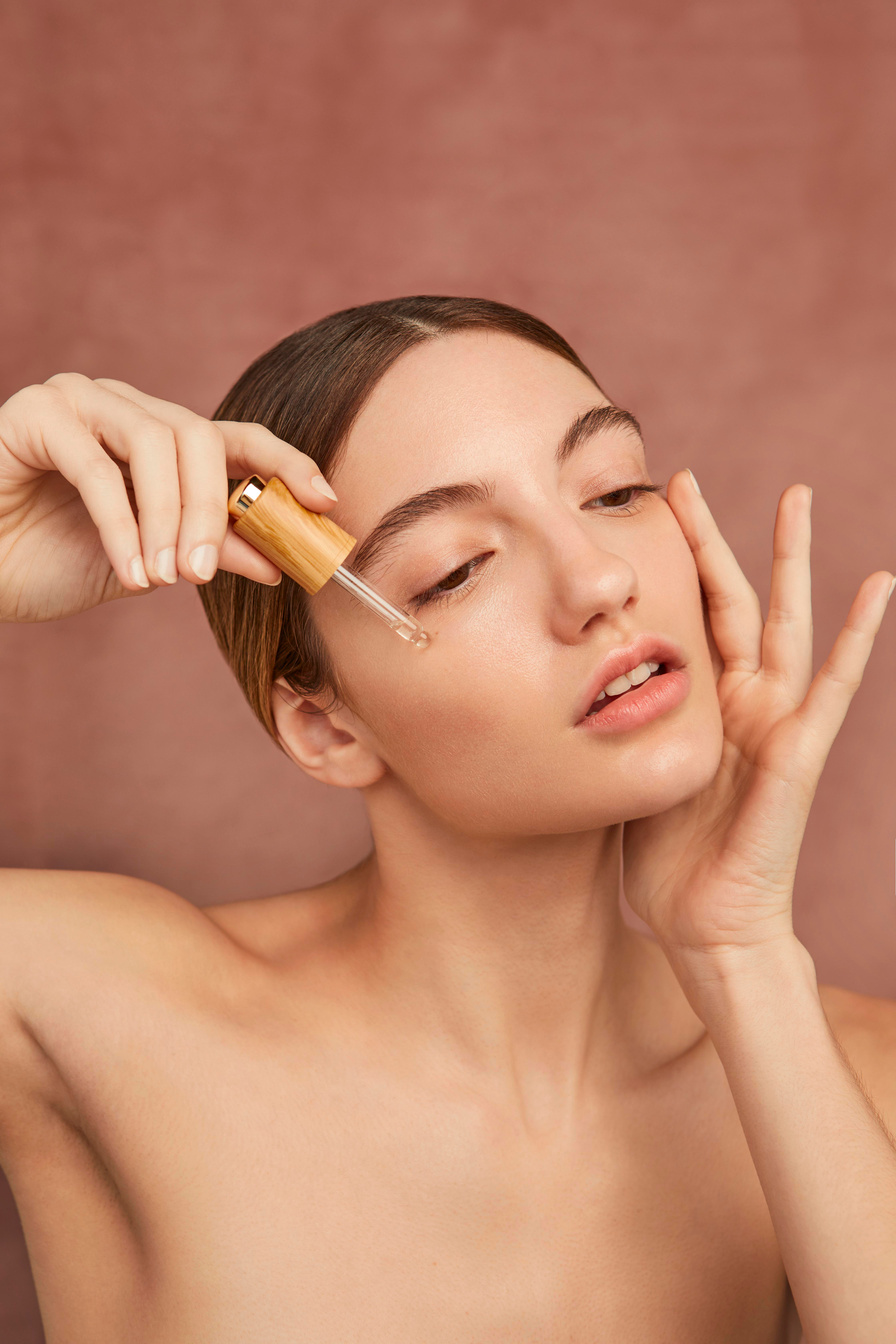 Close up Woman Using Serum